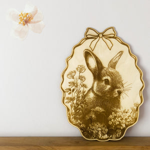An intricately engraved bunny amongst wildflowers image on wood